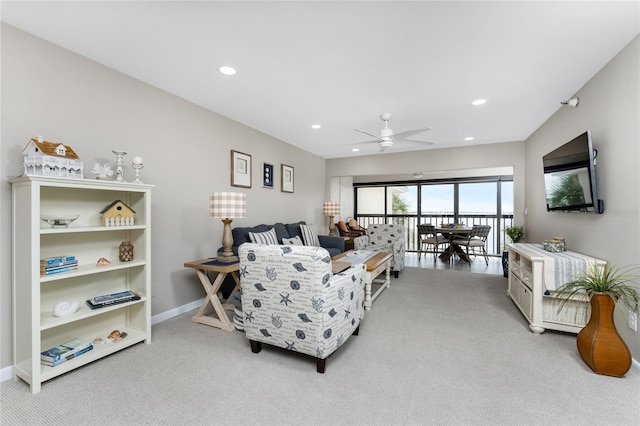 living room featuring light carpet and ceiling fan