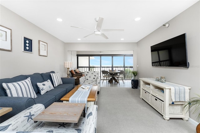 living room with ceiling fan and light carpet