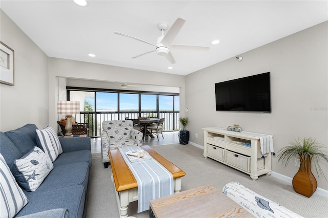 living room with carpet flooring and ceiling fan