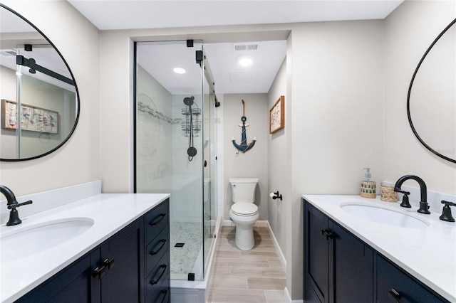 bathroom featuring vanity, toilet, walk in shower, and wood-type flooring