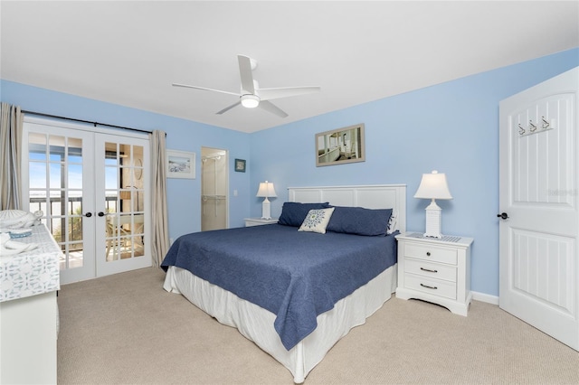 bedroom with french doors, ceiling fan, light carpet, and access to outside