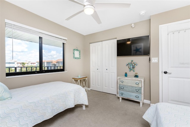 bedroom with a closet, carpet, and ceiling fan