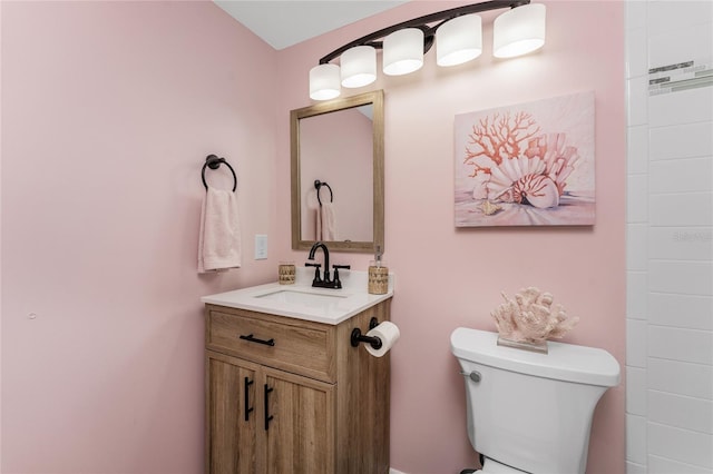 bathroom featuring vanity and toilet