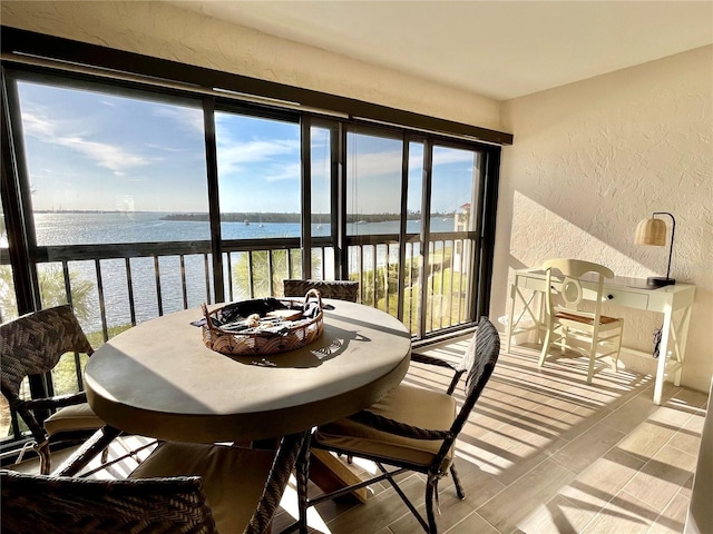 sunroom with a water view