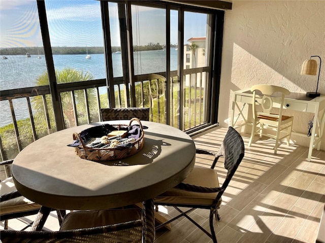 sunroom with a water view