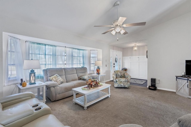 living room with carpet flooring, ceiling fan, and vaulted ceiling