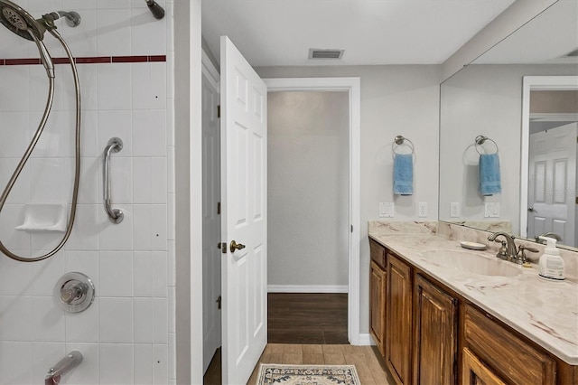 bathroom featuring wood-type flooring and vanity