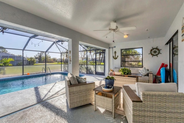 view of swimming pool with an outdoor hangout area, a patio, ceiling fan, and a lanai