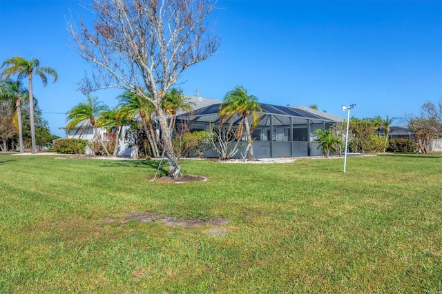 view of yard with a lanai