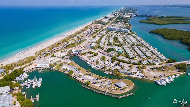 bird's eye view featuring a water view and a view of the beach