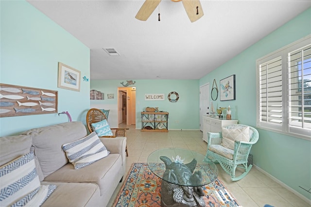 living room with light tile patterned flooring and ceiling fan