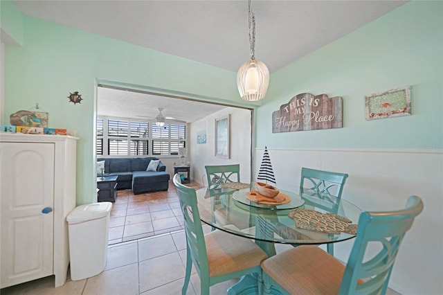 dining room with light tile patterned flooring, ceiling fan, and a textured ceiling