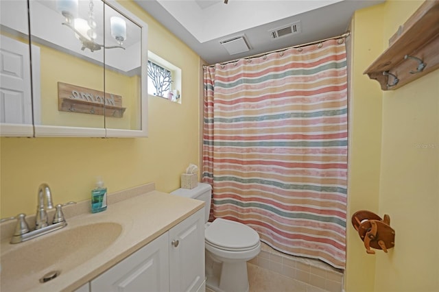 bathroom with a shower with curtain, tile patterned floors, vanity, and toilet