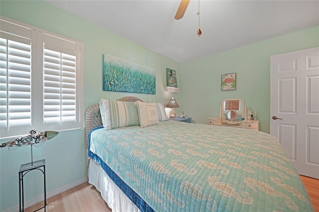 bedroom with light wood-type flooring and ceiling fan