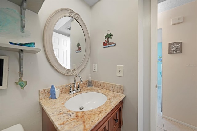 bathroom with vanity and tile patterned flooring