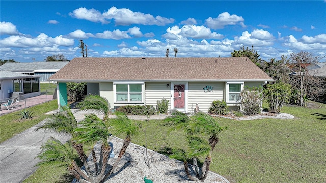 ranch-style home with a front yard