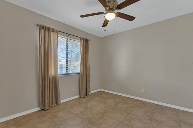 unfurnished room with ceiling fan