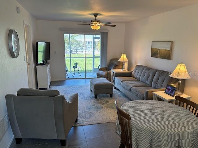 living room featuring ceiling fan