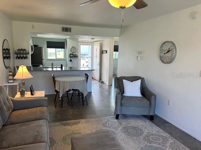 living room featuring ceiling fan