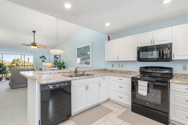 kitchen with kitchen peninsula, ceiling fan, black appliances, white cabinetry, and lofted ceiling