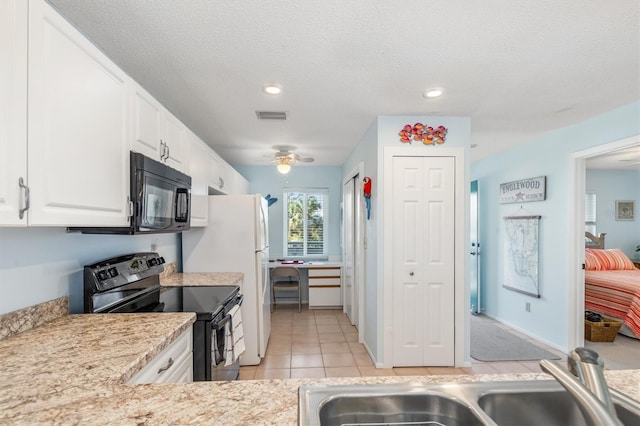 kitchen with electric stove, sink, ceiling fan, a textured ceiling, and white cabinetry