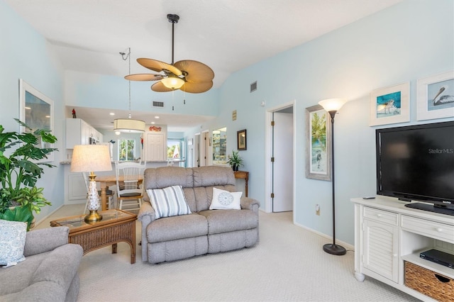 living room featuring ceiling fan and light colored carpet