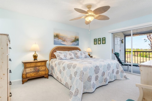 carpeted bedroom with access to outside and ceiling fan