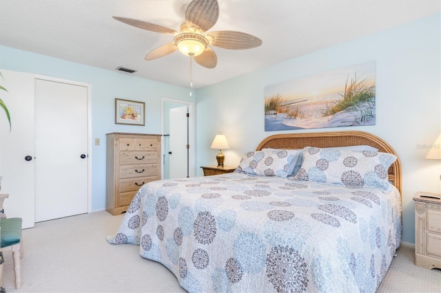 carpeted bedroom featuring ceiling fan