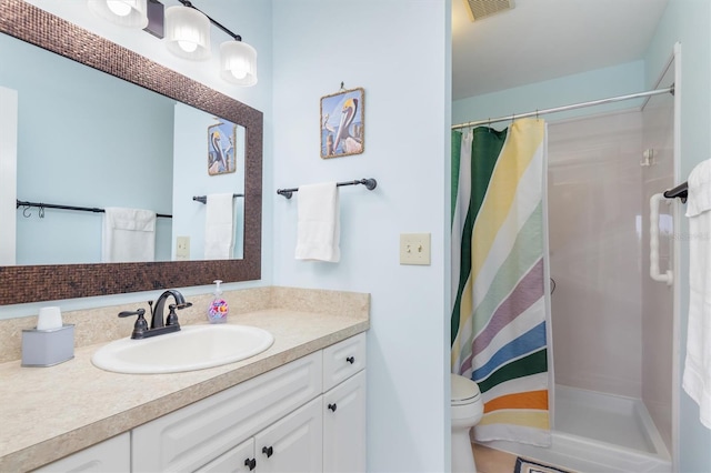 bathroom featuring a shower with curtain, vanity, and toilet