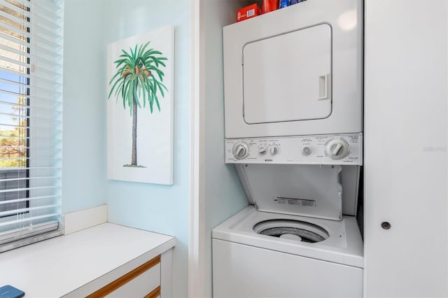 washroom with stacked washer and clothes dryer