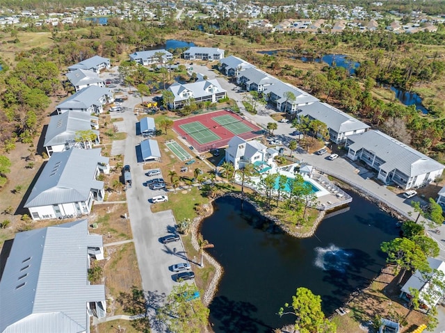 birds eye view of property featuring a residential view and a water view