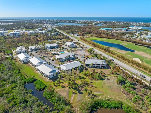 aerial view with view of golf course and a water view