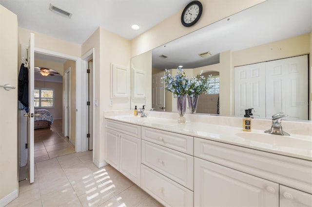 bathroom featuring tile patterned floors, ceiling fan, and vanity