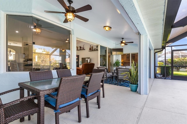 view of patio / terrace featuring glass enclosure and an outdoor hangout area