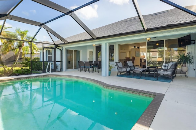 view of swimming pool with a lanai, a patio area, and an outdoor hangout area