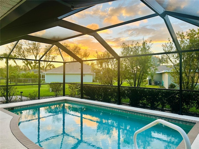 pool at dusk with glass enclosure