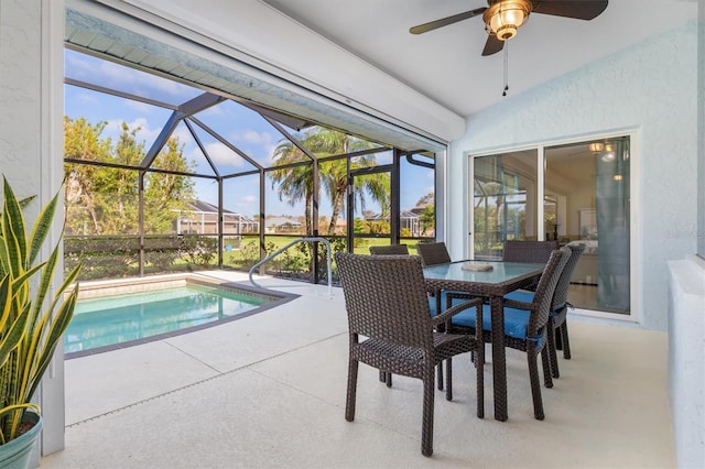 view of swimming pool featuring a lanai, ceiling fan, and a patio