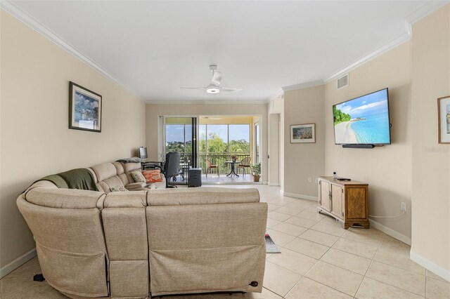 living room with ornamental molding, light tile patterned floors, and ceiling fan