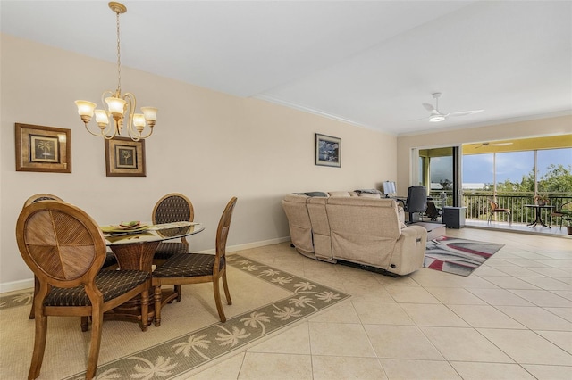 tiled dining space featuring ornamental molding and ceiling fan with notable chandelier