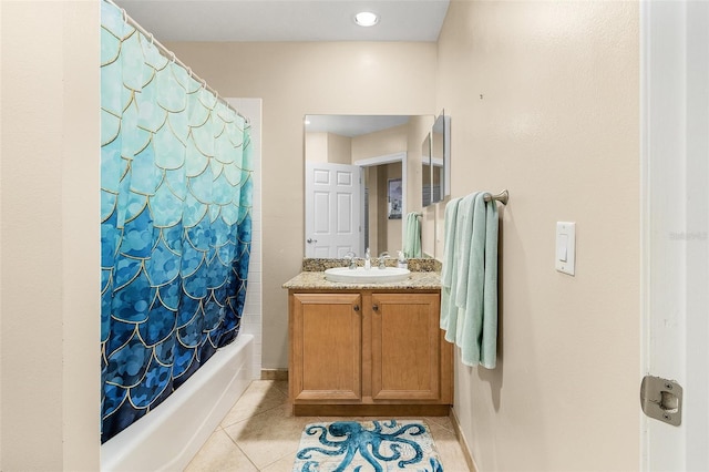 bathroom with vanity, tile patterned floors, and shower / tub combo