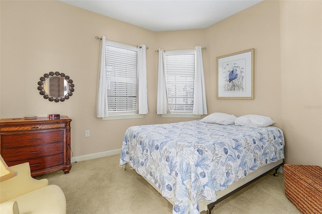 bedroom featuring light colored carpet