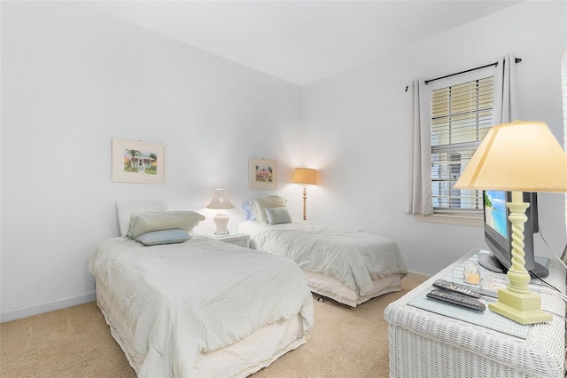 bedroom featuring light colored carpet