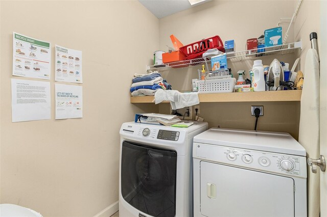 washroom featuring washing machine and dryer