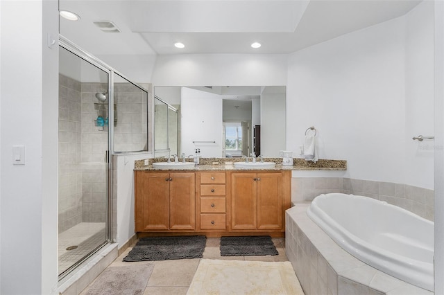 bathroom featuring vanity, plus walk in shower, and tile patterned floors