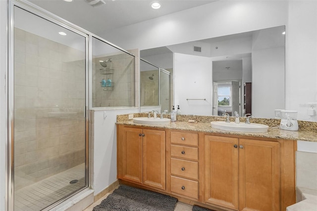 bathroom featuring vanity and walk in shower