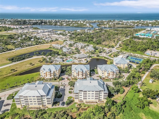 birds eye view of property featuring a water view