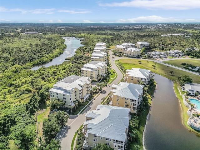 birds eye view of property with a water view