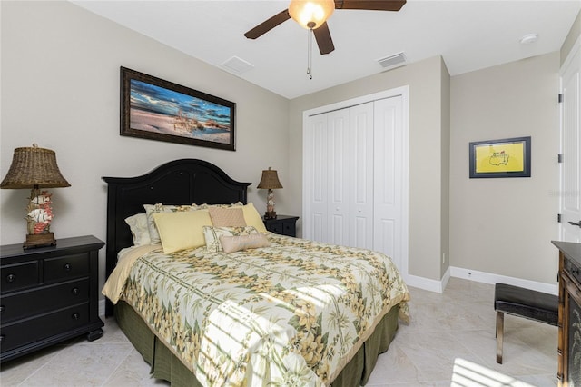 tiled bedroom with a closet and ceiling fan