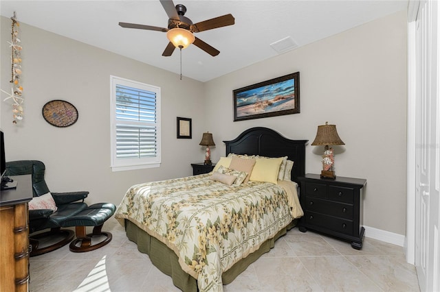 bedroom with light tile patterned flooring and ceiling fan