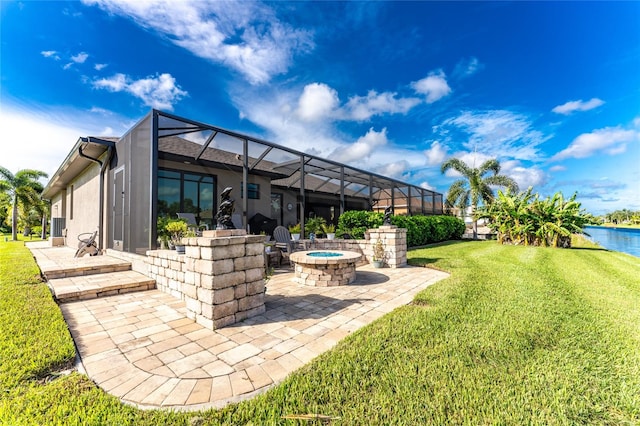 view of yard featuring a patio, a lanai, and a water view